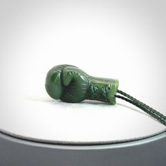 Hand carved boxing glove made from Jade. The cord is adjustable so that you can wear this where it suits you best. The cost of shipping worldwide is included in the price.