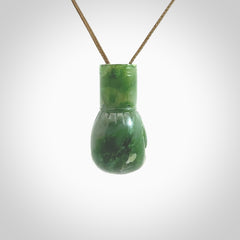 Hand carved boxing glove made from Jade. The cord is adjustable so that you can wear this where it suits you best. The cost of shipping worldwide is included in the price.