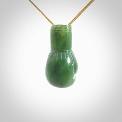 Hand carved boxing glove made from Jade. The cord is adjustable so that you can wear this where it suits you best. The cost of shipping worldwide is included in the price.