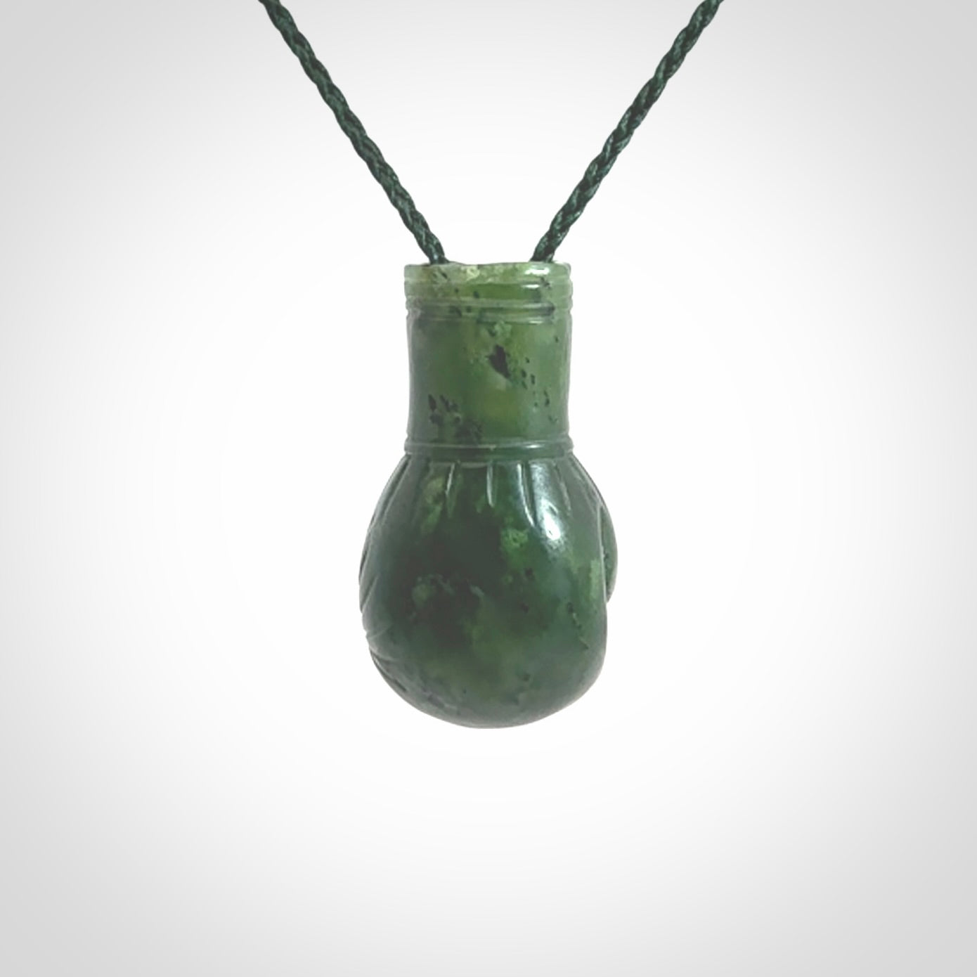 Hand carved British Columbian Jade boxing glove pendants