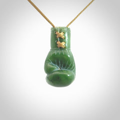 Hand carved boxing glove made from Jade. The cord is adjustable so that you can wear this where it suits you best. The cost of shipping worldwide is included in the price.