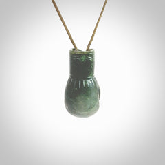 Hand carved boxing glove made from New Zealand Jade. The cord is adjustable so that you can wear this where it suits you best. The cost of shipping worldwide is included in the price.