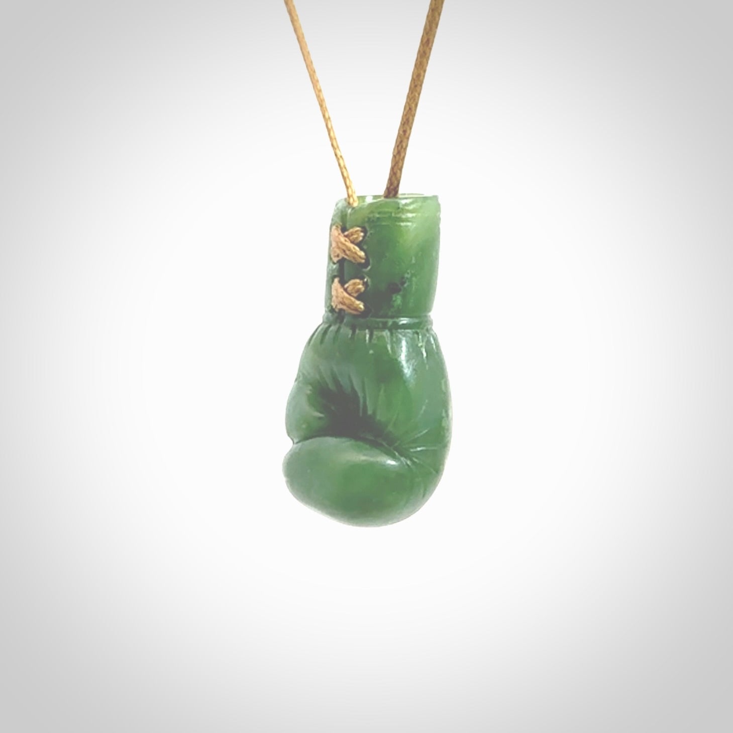 Hand carved boxing glove made from New Zealand Jade. The cord is adjustable so that you can wear this where it suits you best. The cost of shipping worldwide is included in the price.