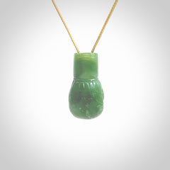 Hand carved boxing glove made from New Zealand Jade. The cord is adjustable so that you can wear this where it suits you best. The cost of shipping worldwide is included in the price.