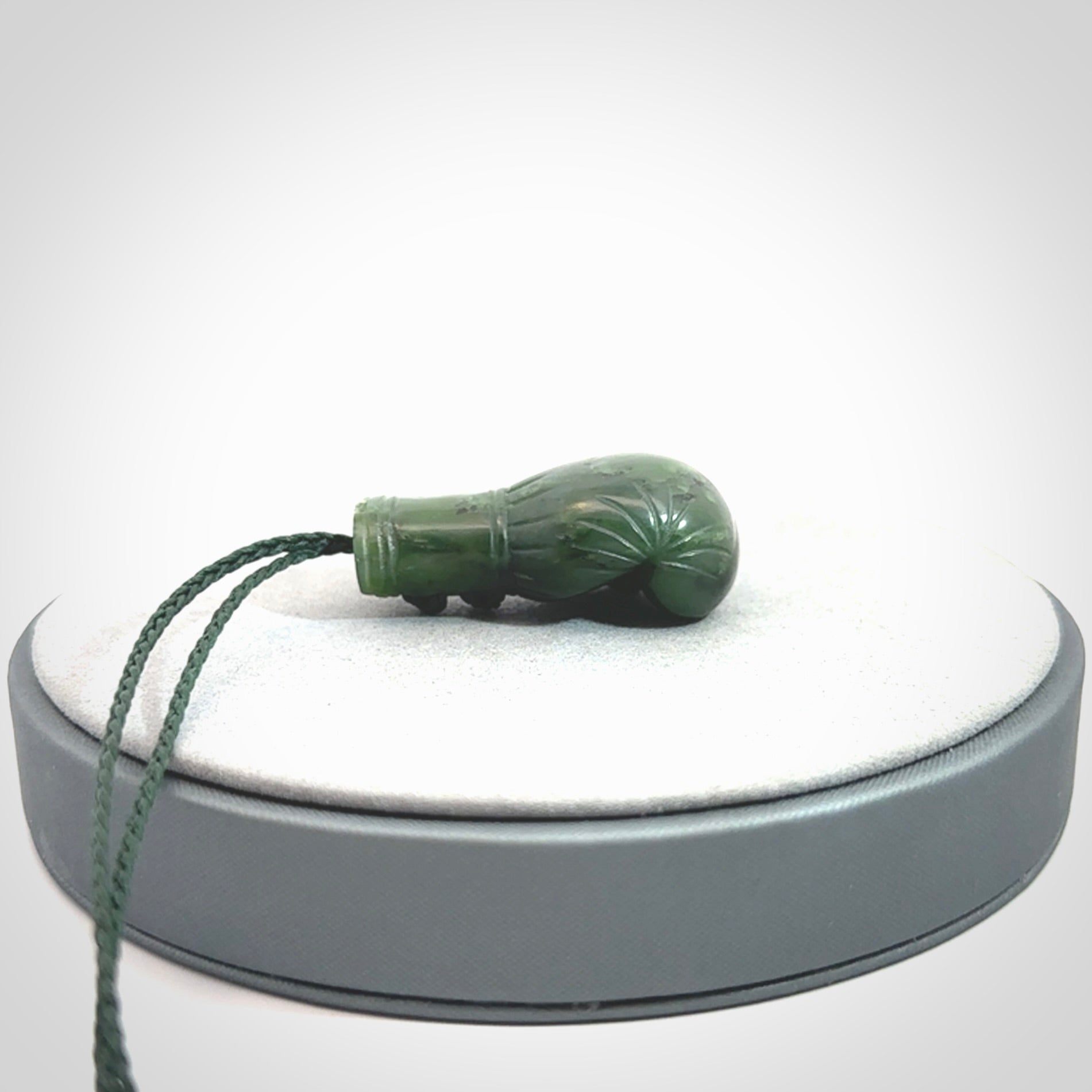 Hand carved British Columbian Jade boxing glove pendants