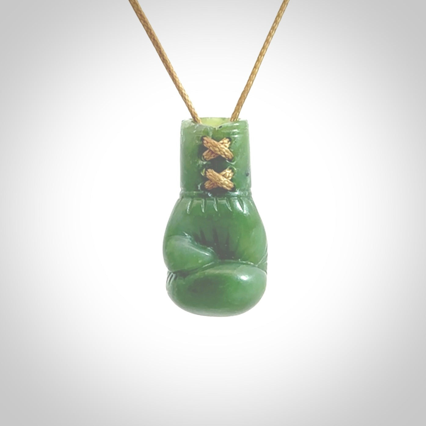 Hand carved boxing glove made from New Zealand Jade. The cord is adjustable so that you can wear this where it suits you best. The cost of shipping worldwide is included in the price.