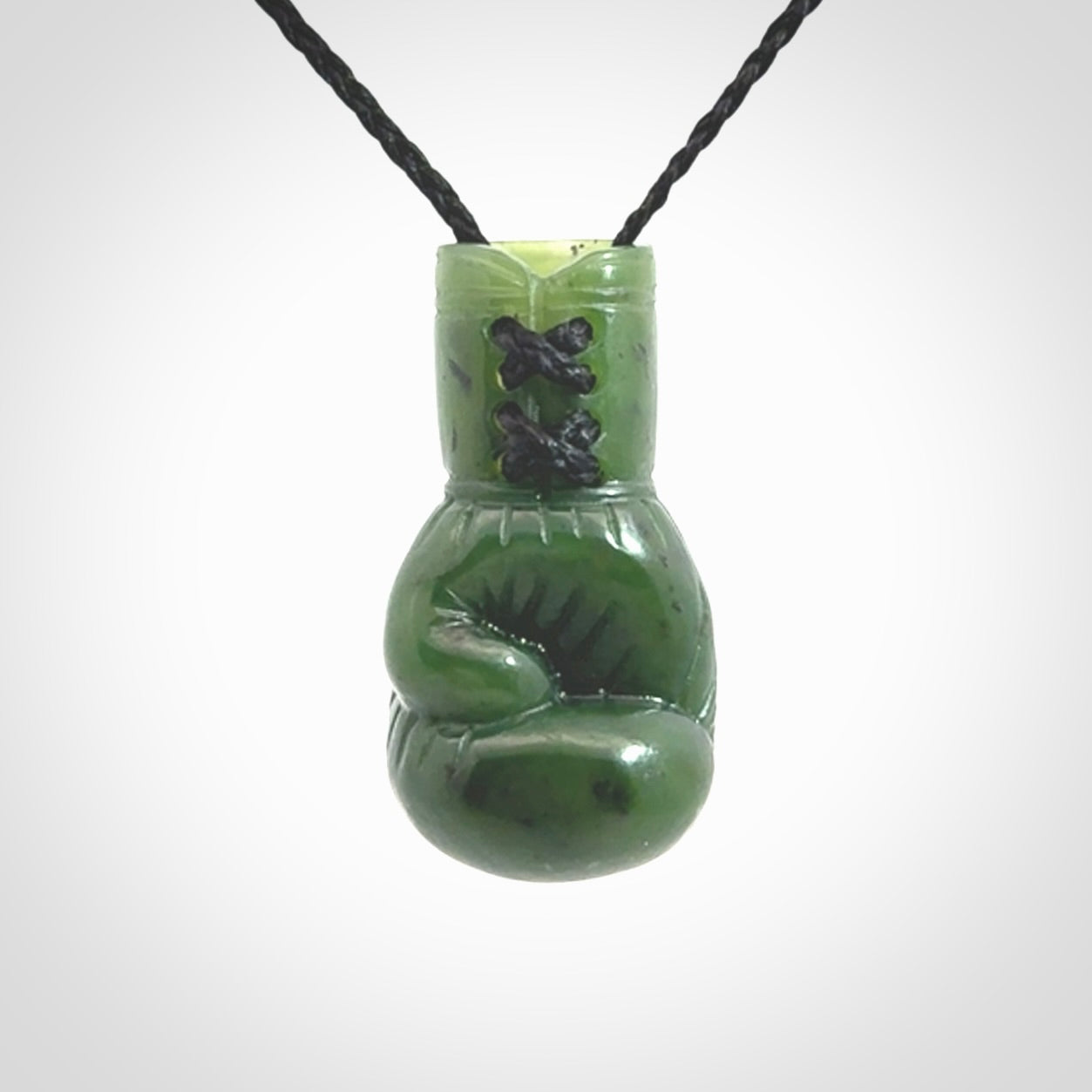 Hand carved boxing glove made from Jade. The cord is adjustable so that you can wear this where it suits you best. The cost of shipping worldwide is included in the price.