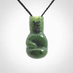 Hand carved boxing glove made from Jade. The cord is adjustable so that you can wear this where it suits you best. The cost of shipping worldwide is included in the price.