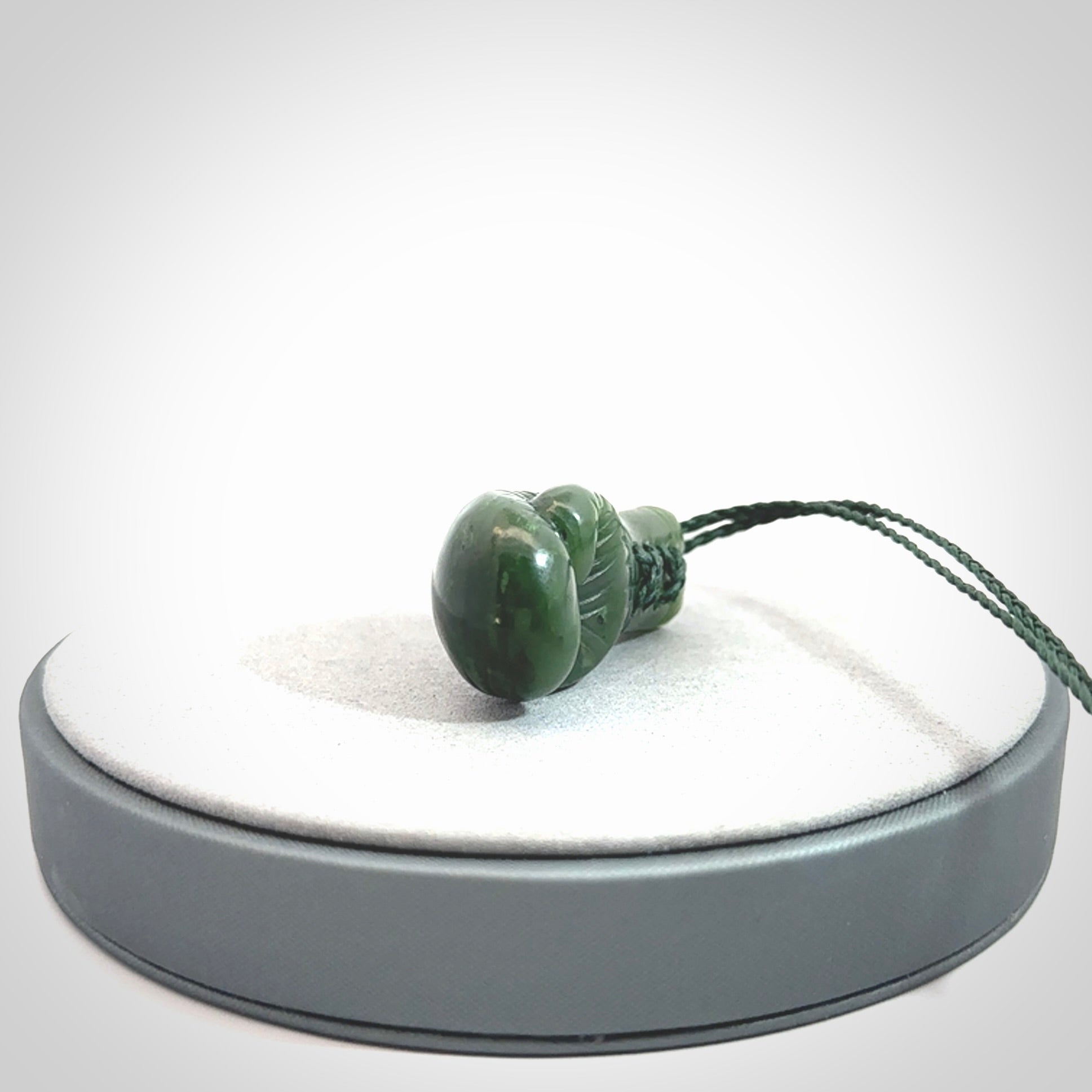 Hand carved British Columbian Jade boxing glove pendants