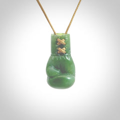 Hand carved boxing glove made from New Zealand Jade. The cord is adjustable so that you can wear this where it suits you best. The cost of shipping worldwide is included in the price.