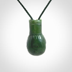 Hand carved boxing glove made from Jade. The cord is adjustable so that you can wear this where it suits you best. The cost of shipping worldwide is included in the price.
