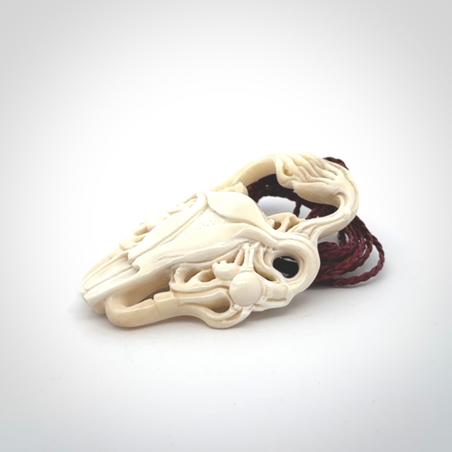 This is a hand carved contemporary bison bone skull pendant. This is a medium sized necklace and is a very unique, one only, pendant that is a piece for bison lovers.