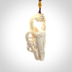 This is a hand carved contemporary bison bone skull pendant. This is a medium sized necklace and is a very unique, one only, pendant that is a piece for bison lovers.