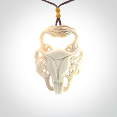 This is a hand carved contemporary bison bone skull pendant. This is a medium sized necklace and is a very unique, one only, pendant that is a piece for bison lovers.