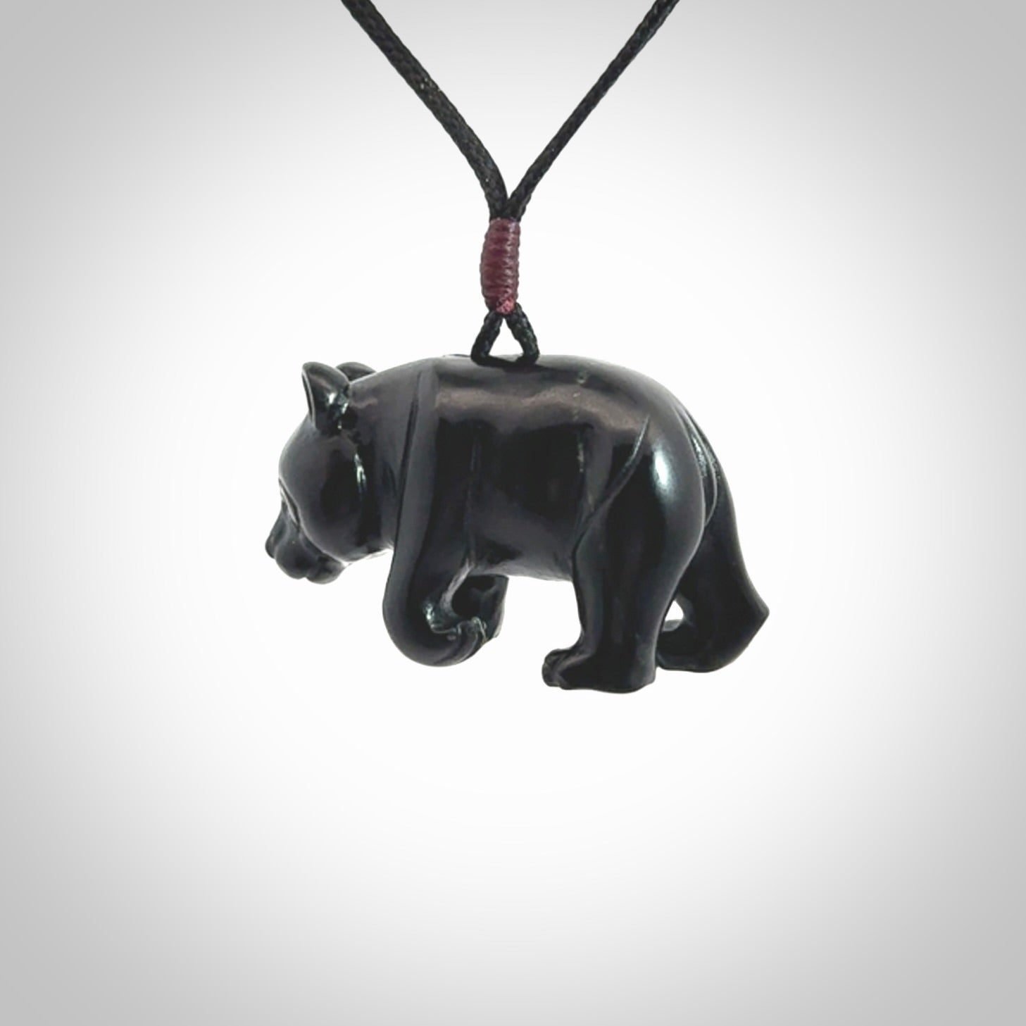 This picture shows a pendant that we designed in black jade. It is a little black bear that has a walking stance and is carved in detail. A really attractive and eye-catching piece of handmade jewellery. The cord is black and the length can be adjusted.