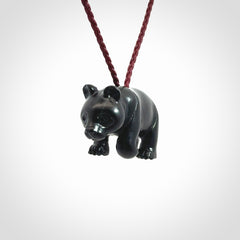 This picture shows a pendant that we designed in black jade. It is a little black bear that has a walking stance and is carved in detail. A really attractive and eye-catching piece of handmade jewellery. The cord is burgundy and the length can be adjusted.