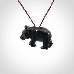 This picture shows a pendant that we designed in black jade. It is a little black bear that has a walking stance and is carved in detail. A really attractive and eye-catching piece of handmade jewellery. The cord is burgundy and the length can be adjusted.