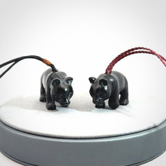 This picture shows a pendant that we designed in black jade. It is a little black bear that has a walking stance and is carved in detail. A really attractive and eye-catching piece of handmade jewellery. The cord is adjustable.
