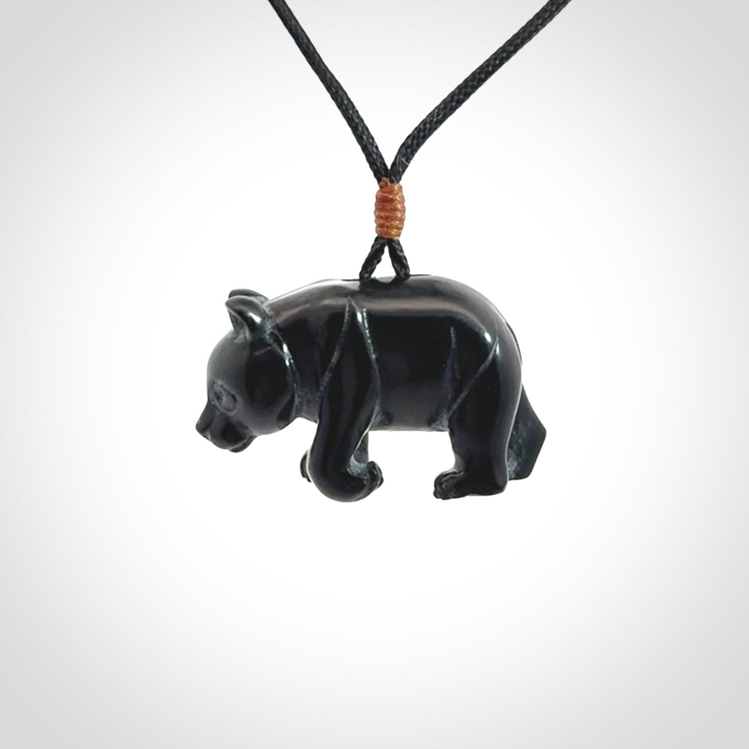 This picture shows a pendant that we designed in black jade. It is a little black bear that has a walking stance and is carved in detail. A really attractive and eye-catching piece of handmade jewellery. The cord is black and the length can be adjusted.