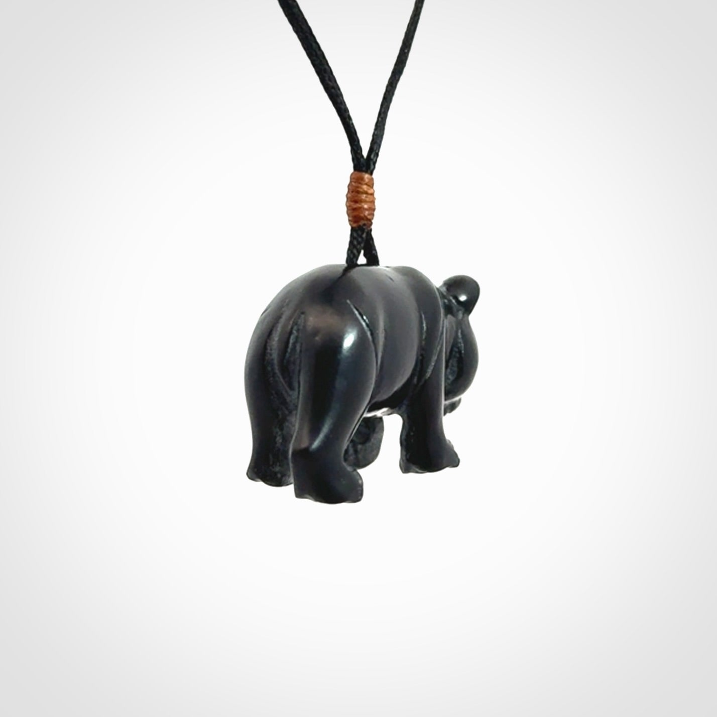 This picture shows a pendant that we designed in black jade. It is a little black bear that has a walking stance and is carved in detail. A really attractive and eye-catching piece of handmade jewellery. The cord is black and the length can be adjusted.