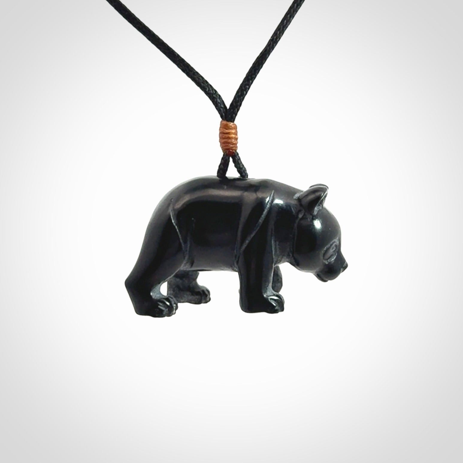 This picture shows a pendant that we designed in black jade. It is a little black bear that has a walking stance and is carved in detail. A really attractive and eye-catching piece of handmade jewellery. The cord is black and the length can be adjusted.