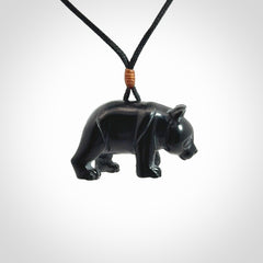 This picture shows a pendant that we designed in black jade. It is a little black bear that has a walking stance and is carved in detail. A really attractive and eye-catching piece of handmade jewellery. The cord is black and the length can be adjusted.