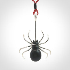 Hand crafted black jade and sterling silver spider necklace. This necklace is provided with a red adjustable cord. Contemporary black jade spider necklace with sterling silver. Delivered with express courier and packaged in a woven kete pouch.