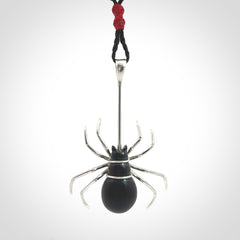 Hand crafted black jade and sterling silver spider necklace. This necklace is provided with a black adjustable cord. Contemporary black jade spider necklace with sterling silver. Delivered with express courier and packaged in a woven kete pouch.