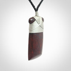 This is a beautiful hand carved Red Jasper Stone toki pendant. A really cool piece that is made from this rare and beautiful material. The red jasper has a very distinctive look and each piece is different. We ship this worldwide and the cost of shipping is included in the price. Provided with adjustable cords and packaged in a woven kete pouch.