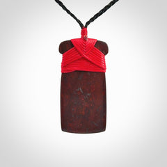 This is a beautiful hand carved Red Jasper Stone toki pendant. A really cool piece that is made from this rare and beautiful material. The red jasper has a very distinctive look and each piece is different. We ship this worldwide and the cost of shipping is included in the price. Provided with adjustable cords and packaged in a woven kete pouch.
