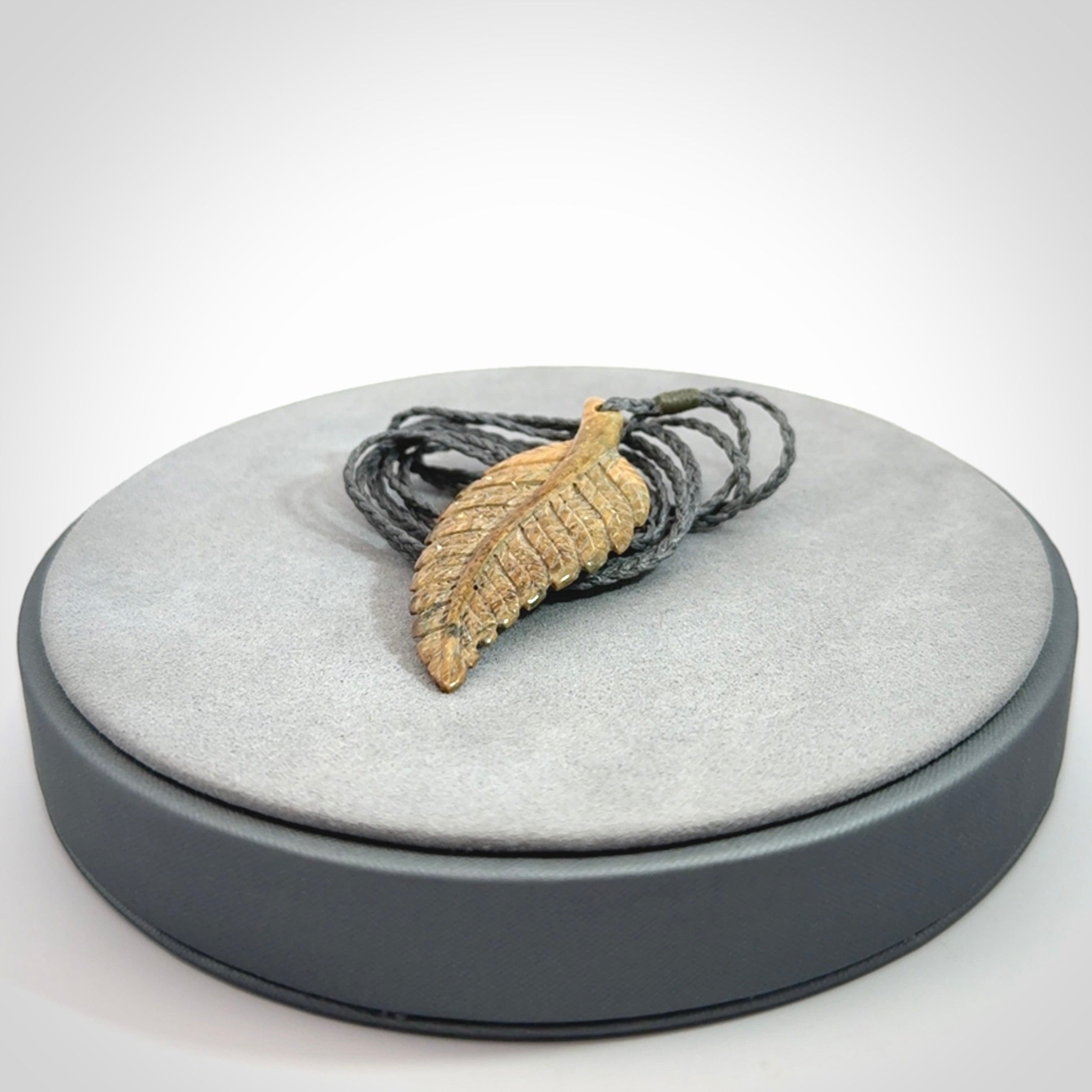 Hand carved blue Mammoth Tusk feather pendant with hand plaited adjustable cord. Woolly Mammoth tusk feather necklace. Hand carved by NZ Pacific. Art to Wear.