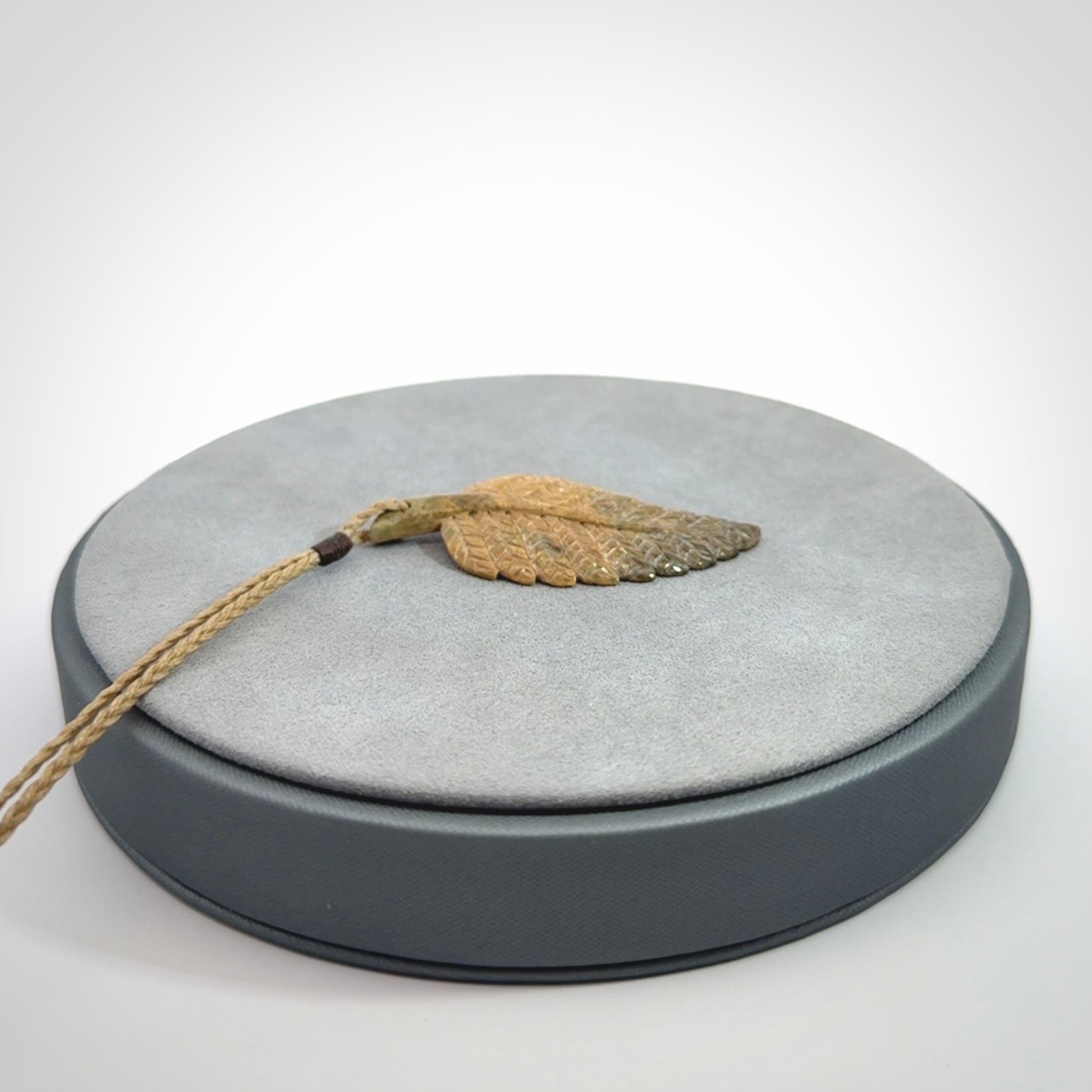 Hand carved blue Mammoth Tusk feather pendant with hand plaited adjustable cord. Woolly Mammoth tusk feather necklace. Hand carved by NZ Pacific. Art to Wear.