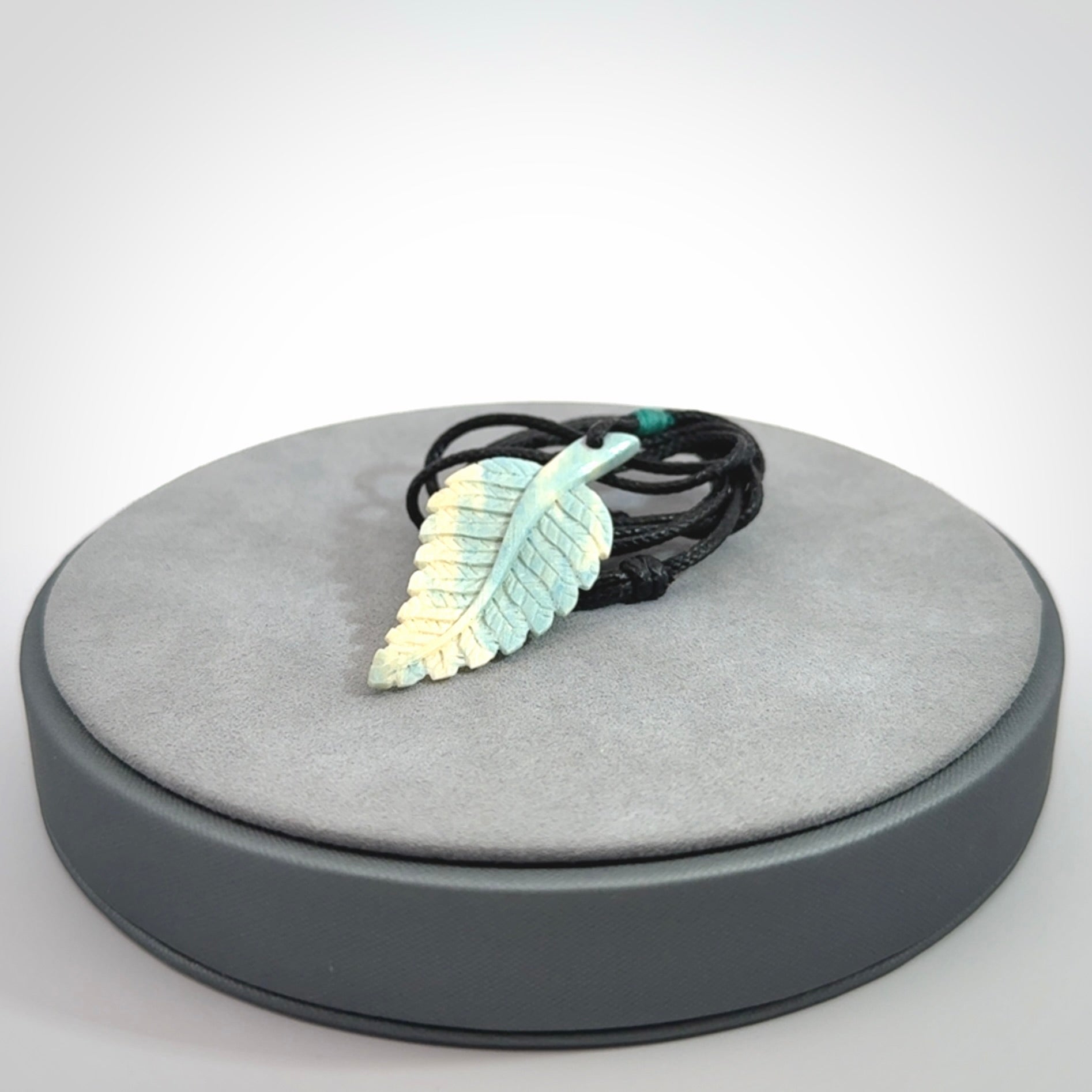 Hand carved blue Mammoth Tusk feather pendant with adjustable cord. Woolly Mammoth tusk feather necklace. Hand carved by NZ Pacific. Art to Wear.