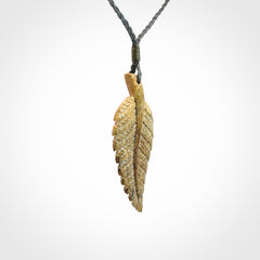 Hand carved blue Mammoth Tusk feather pendant with hand plaited adjustable cord. Woolly Mammoth tusk feather necklace. Hand carved by NZ Pacific. Art to Wear.