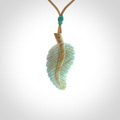 Hand carved blue Mammoth Tusk feather pendant with adjustable cord. Woolly Mammoth tusk feather necklace. Hand carved by NZ Pacific. Art to Wear.