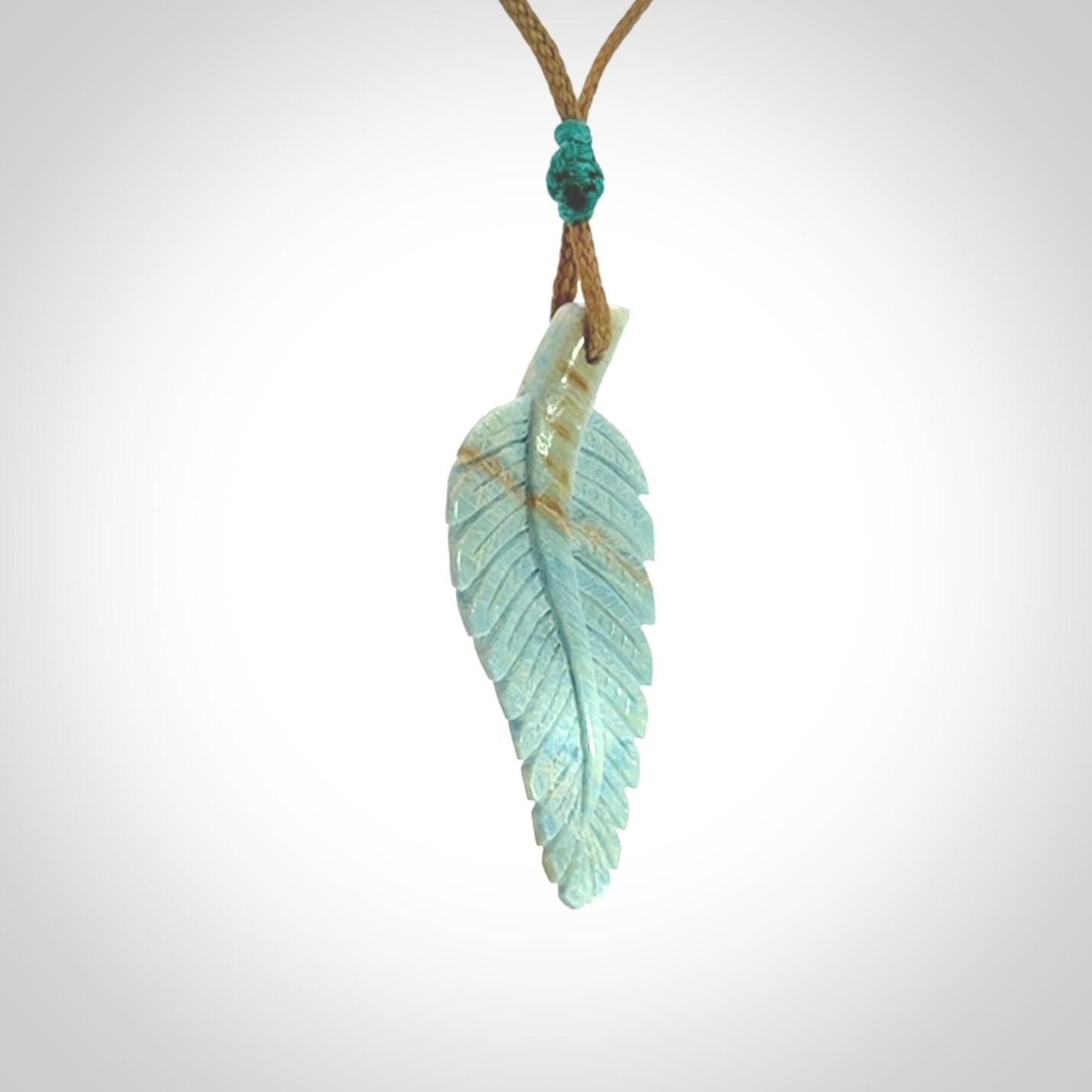 Hand carved blue Mammoth Tusk feather pendant with adjustable cord. Woolly Mammoth tusk feather necklace. Hand carved by NZ Pacific. Art to Wear.