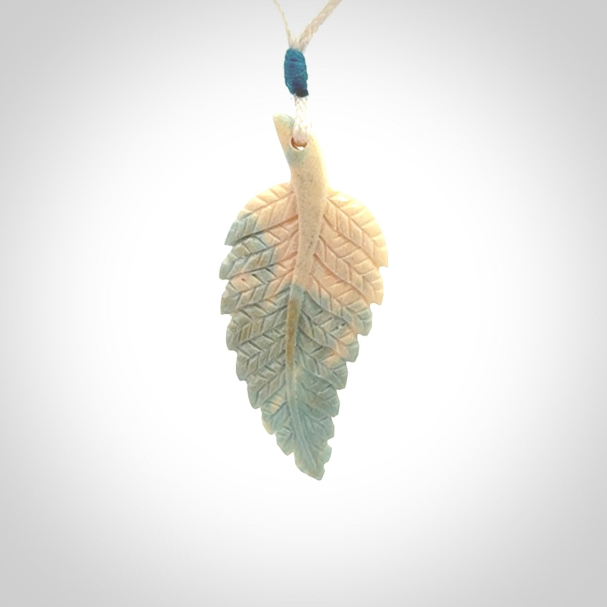 Hand carved blue Mammoth Tusk feather pendant with adjustable cord. Woolly Mammoth tusk feather necklace. Hand carved by NZ Pacific. Art to Wear.