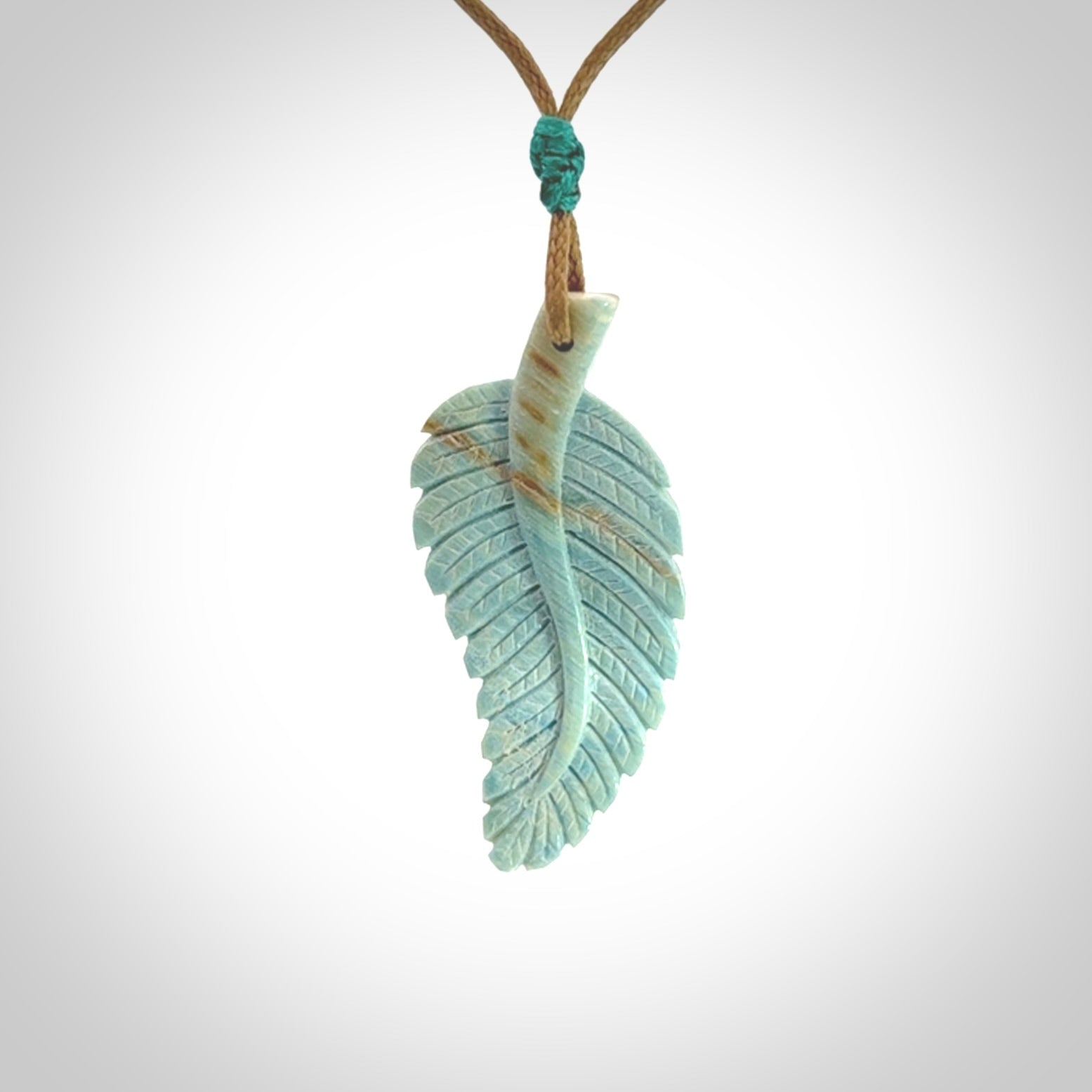 Hand carved blue Mammoth Tusk feather pendant with adjustable cord. Woolly Mammoth tusk feather necklace. Hand carved by NZ Pacific. Art to Wear.