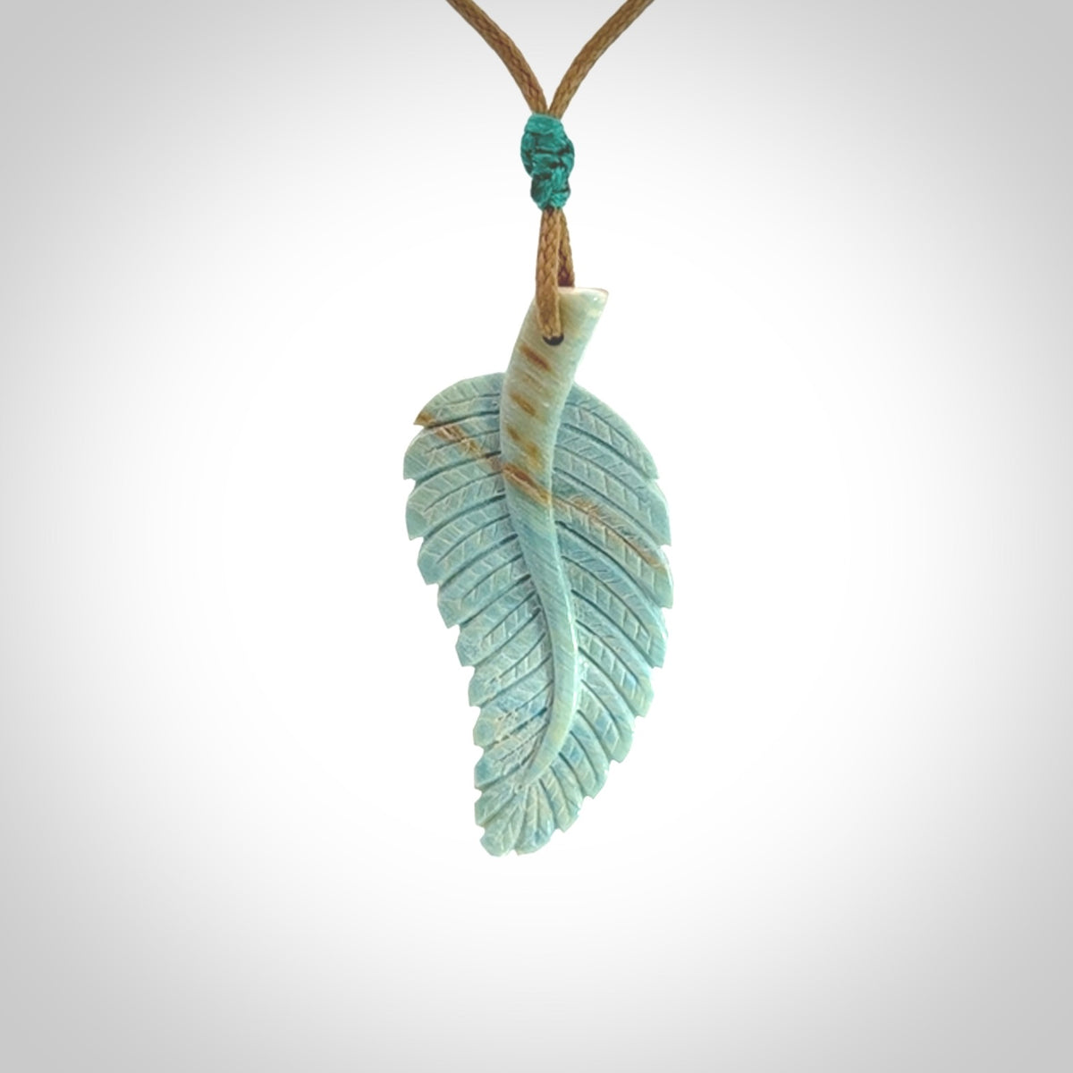 Hand carved blue Mammoth Tusk feather pendant with adjustable cord. Woolly Mammoth tusk feather necklace. Hand carved by NZ Pacific. Art to Wear.
