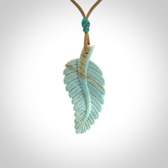 Hand carved blue Mammoth Tusk feather pendant with adjustable cord. Woolly Mammoth tusk feather necklace. Hand carved by NZ Pacific. Art to Wear.