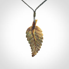 Hand carved blue Mammoth Tusk feather pendant with hand plaited adjustable cord. Woolly Mammoth tusk feather necklace. Hand carved by NZ Pacific. Art to Wear.