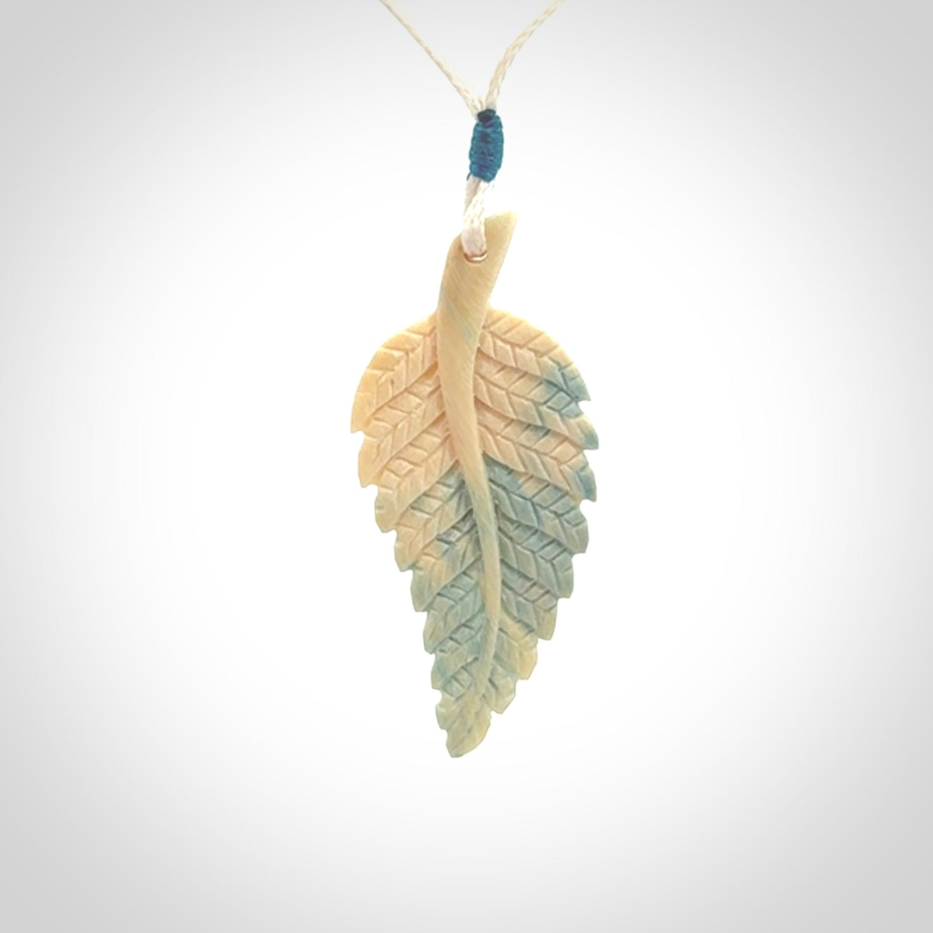 Hand carved blue Mammoth Tusk feather pendant with adjustable cord. Woolly Mammoth tusk feather necklace. Hand carved by NZ Pacific. Art to Wear.