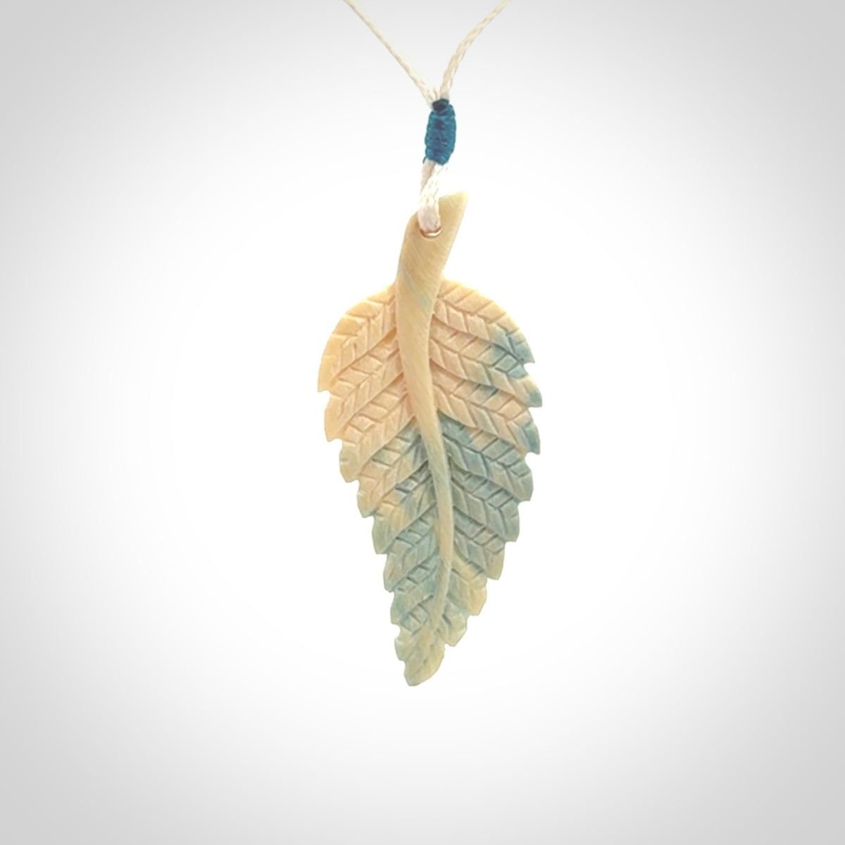 Hand carved blue Mammoth Tusk feather pendant with adjustable cord. Woolly Mammoth tusk feather necklace. Hand carved by NZ Pacific. Art to Wear.