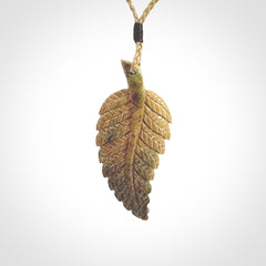 Hand carved blue Mammoth Tusk feather pendant with adjustable cord. Woolly Mammoth tusk feather necklace. Hand carved by NZ Pacific. Art to Wear.