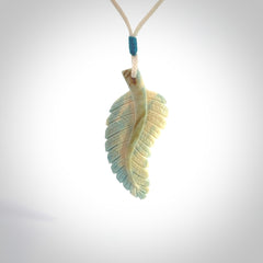 Hand carved blue Mammoth Tusk feather pendant with adjustable cord. Woolly Mammoth tusk feather necklace. Hand carved by NZ Pacific. Art to Wear.