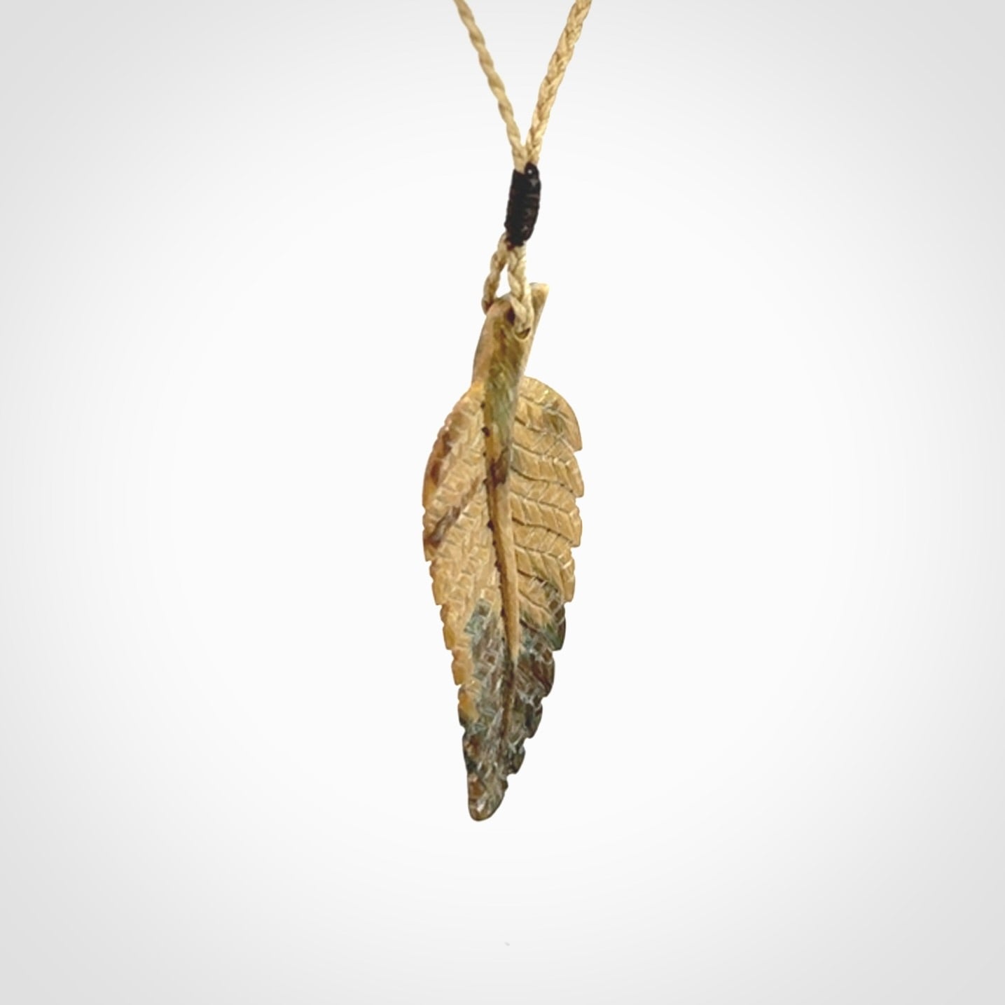 Hand carved blue Mammoth Tusk feather pendant with adjustable cord. Woolly Mammoth tusk feather necklace. Hand carved by NZ Pacific. Art to Wear.