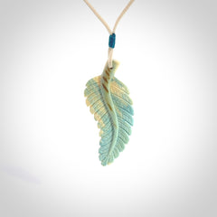 Hand carved blue Mammoth Tusk feather pendant with adjustable cord. Woolly Mammoth tusk feather necklace. Hand carved by NZ Pacific. Art to Wear.