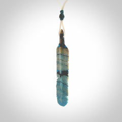 Hand carved Woolly Mammoth Tusk Blue Jay feather pendant. Hand made from Mammoth Tusk stabilised with resin. Art to Wear, one only. Provided with adjustable cord.