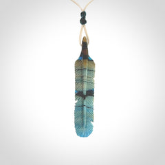 Hand carved Woolly Mammoth Tusk Blue Jay feather pendant. Hand made from Mammoth Tusk stabilised with resin. Art to Wear, one only. Provided with adjustable cord.