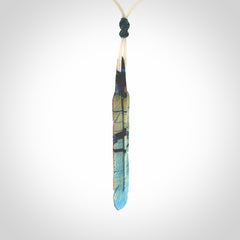 Hand carved Woolly Mammoth Tusk Blue Jay feather pendant. Hand made from Mammoth Tusk stabilised with resin. Art to Wear, one only. Provided with adjustable cord.